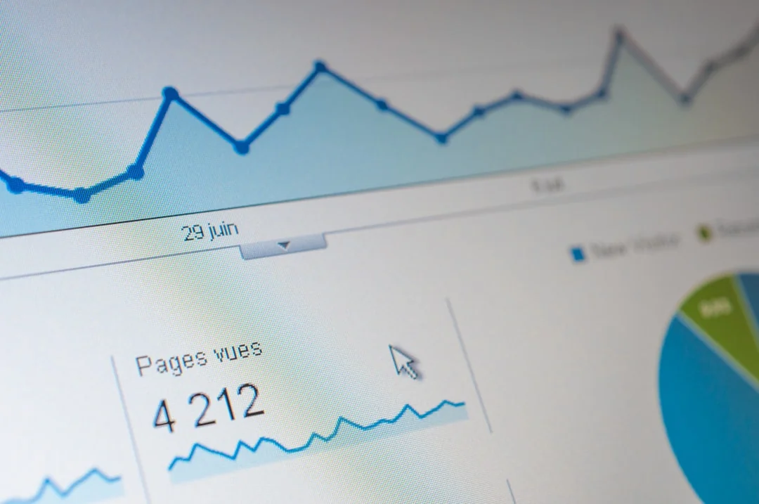 A close-up view of a social media marketing document laid out on a desk beside a pen and notebook.